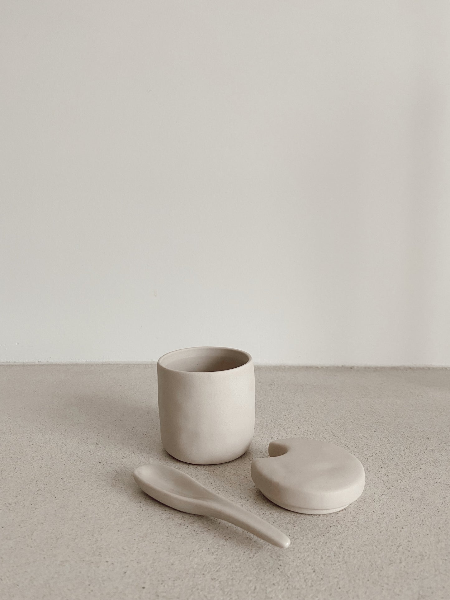 Stoneware cellar & spoon